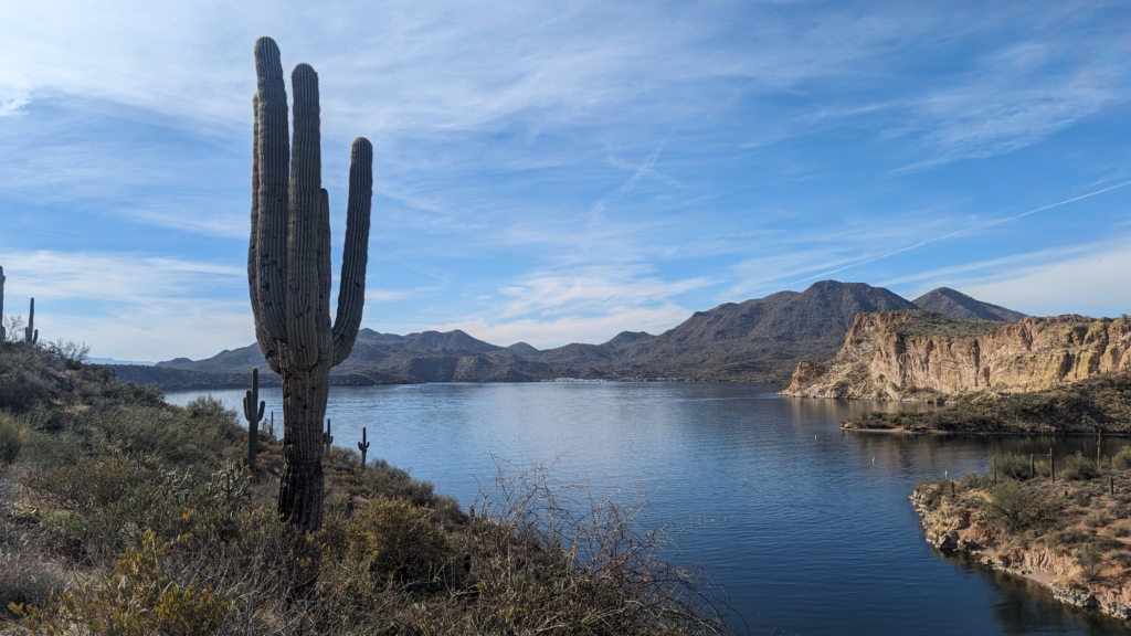 Hiking trail with cactus and view of the lake.